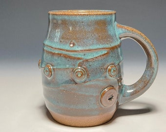 Ceramic mug with pressed studs, Wheel-thrown stoneware pottery in Turquoise glaze, 10 ounce capacity.