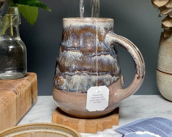 Ceramic mug, Wheel-thrown stoneware pottery in Breaking Tide glaze, 16 ounce capacity.