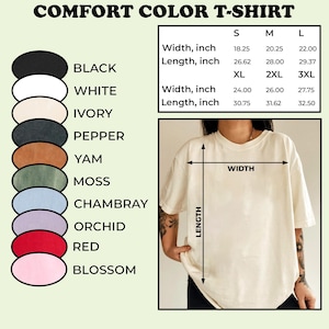 May include: A Comfort Color T-shirt in a cream color, with a size chart showing width and length measurements in inches. Color options include black, white, ivory, pepper, yam, moss, chambray, orchid, red, and blossom.