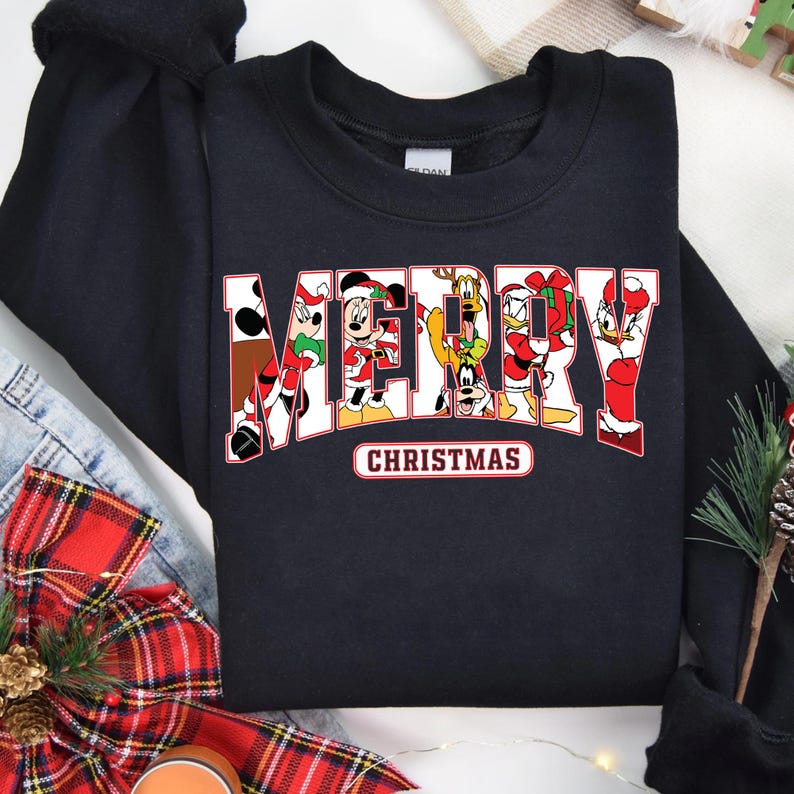 May include: Black sweatshirt with a red and white "Merry Christmas" graphic featuring Mickey Mouse, Minnie Mouse, Donald Duck, Goofy, and Pluto.