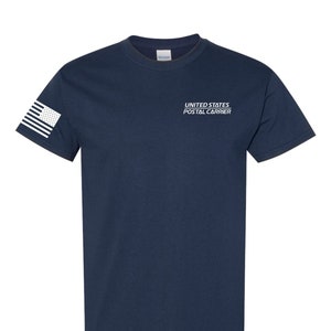 May include: A navy blue t-shirt with a white American flag on the left sleeve and the text "UNITED STATES POSTAL CARRIER" on the front.