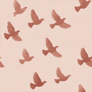 May include: A repeating pattern of brown doves in flight against a light pink background. The doves are depicted with detailed wings and are evenly spaced across the fabric, creating a sense of movement and peace.