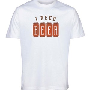 May include: White t-shirt with the phrase "I NEED BEER" in brown letters above four orange beer can illustrations. The shirt is a short-sleeved crew neck.