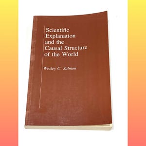 May include: A hardcover book titled "Scientific Explanation and the Causal Structure of the World" by Wesley C. Salmon. The book has a brown cover with white text. The book is in good condition.