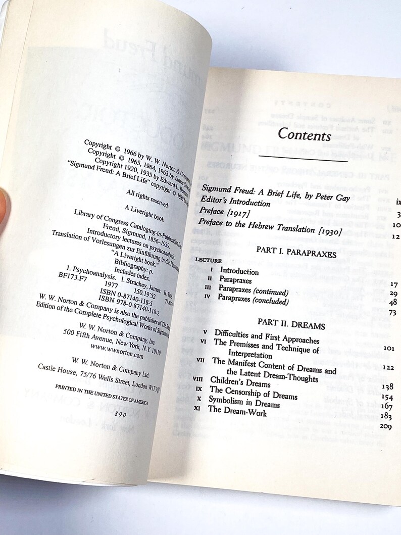 a person holding a book open to a page