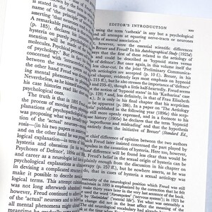 a person holding a book open to a page