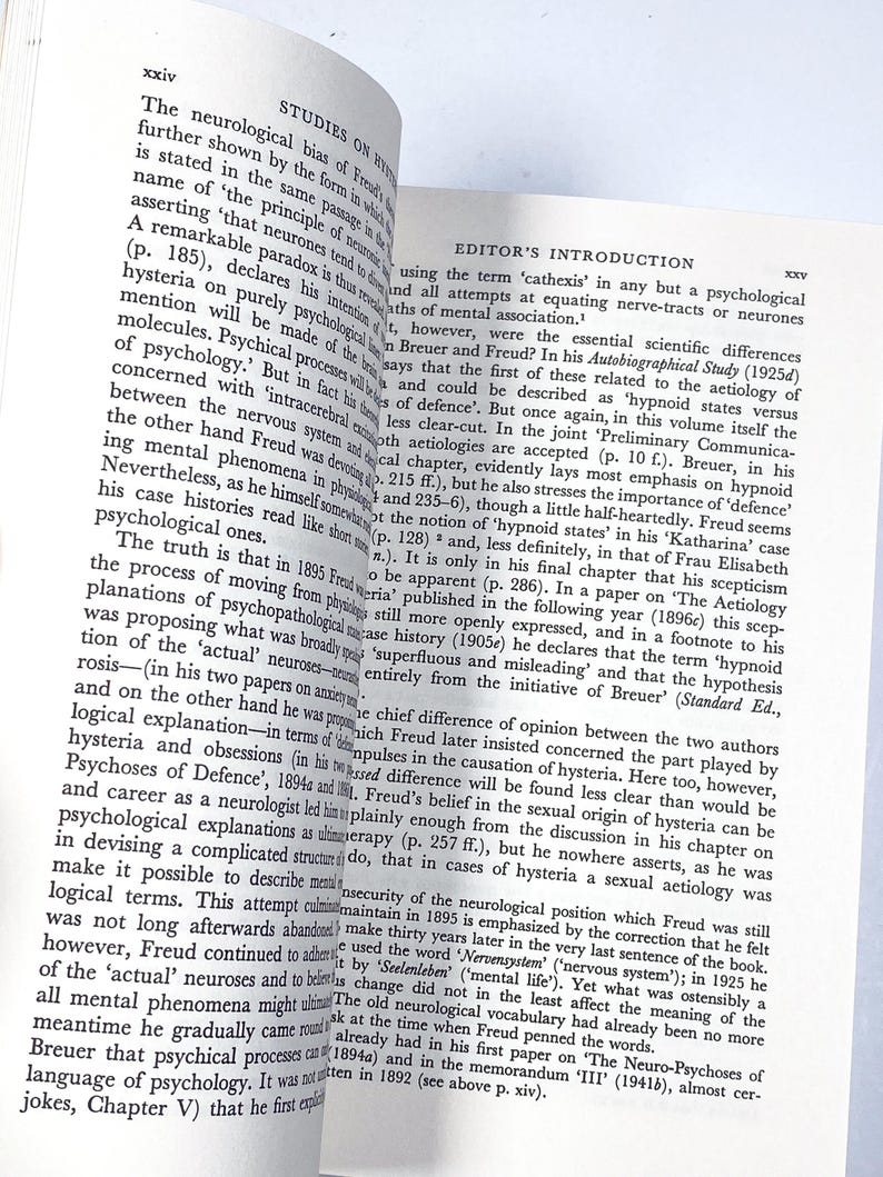 a person holding a book open to a page