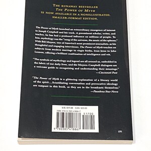 a book with a black cover on a white surface