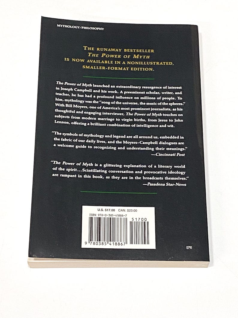 a book with a black cover on a white surface