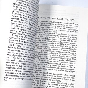 a close up of an open book on a table