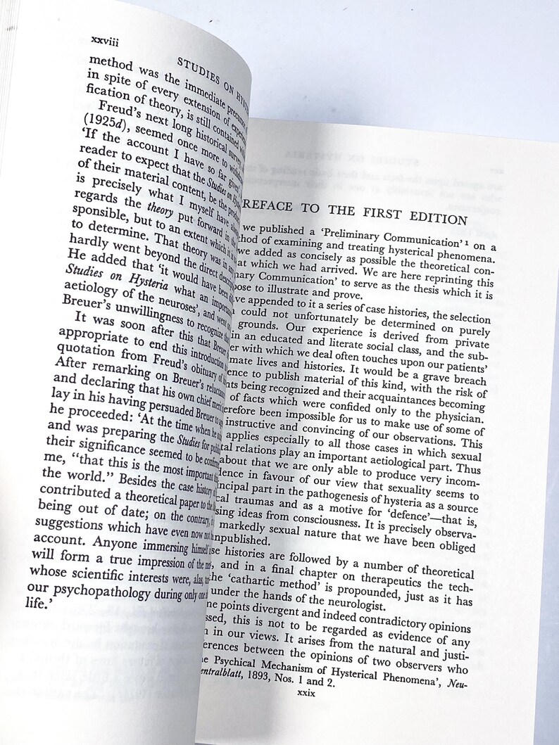 a close up of an open book on a table