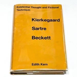 May include: A hardcover book titled "Existential Thought and Fictional Technique:" with the authors Kierkegaard, Sartre, and Beckett. The book has a mustard yellow cover with black text and the author's name, Edith Kern, at the bottom.