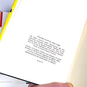 a person holding a book open to a page