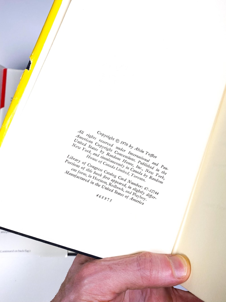 a person holding a book open to a page