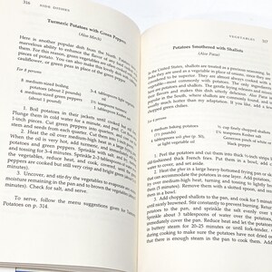 May include: A vintage cookbook page with two recipes for side dishes: Turmeric Potatoes with Green Peppers and Potatoes Smothered with Shallots. The recipes include ingredients, instructions, and serving suggestions.