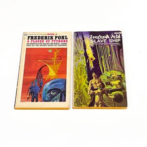 May include: Two vintage science fiction paperback books with colorful covers. The book on the left is titled "A Plague of Pythons" by Frederik Pohl. The book on the right is titled "Slave Ship" by Frederik Pohl.