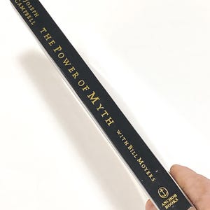 a person holding a pencil in their hand