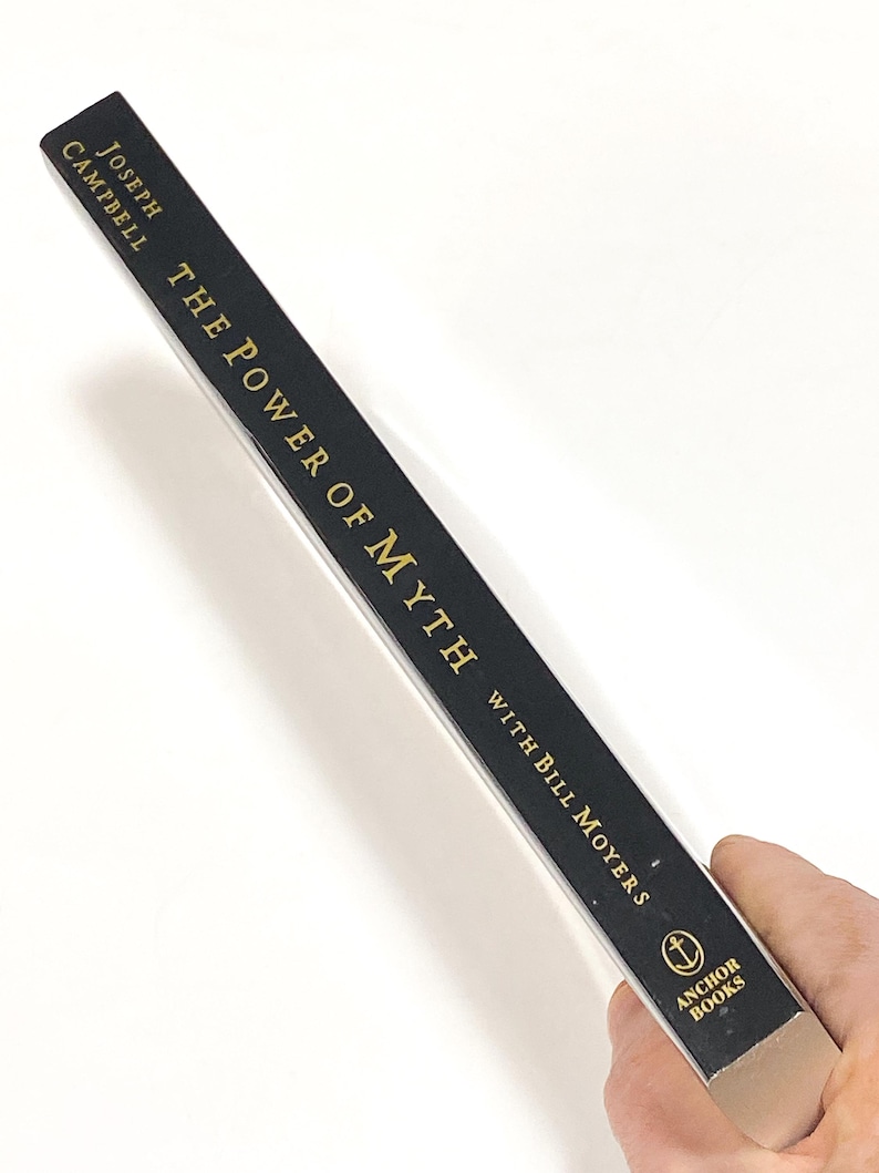a person holding a pencil in their hand