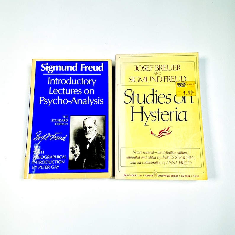 two books sitting next to each other on a table