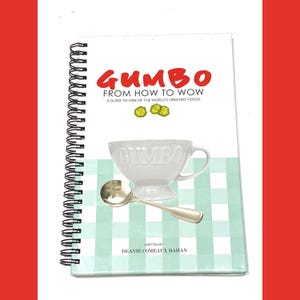 May include: A spiral-bound cookbook titled "Gumbo From How to Wow." The cover features the word "Gumbo" in red, a white cup, and a silver spoon. The background has a light green and white checkered pattern. The author's name is also on the cover.