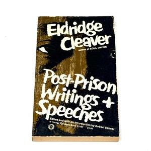 May include: A vintage paperback book titled "Post-Prison Writings + Speeches" by Eldridge Cleaver. The cover features white text on a black and brown background with an eye graphic. The book is a Vintage Ramparts Book.