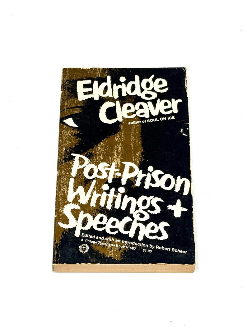 May include: A vintage paperback book titled "Post-Prison Writings + Speeches" by Eldridge Cleaver. The cover features white text on a black and brown background with an eye graphic. The book is a Vintage Ramparts Book.