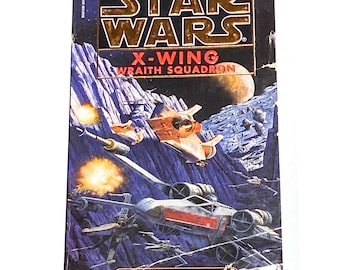 May include: A Star Wars book cover featuring a spaceship in a space battle. The book is titled "X-Wing Wraith Squadron" and is book 5 in the series.