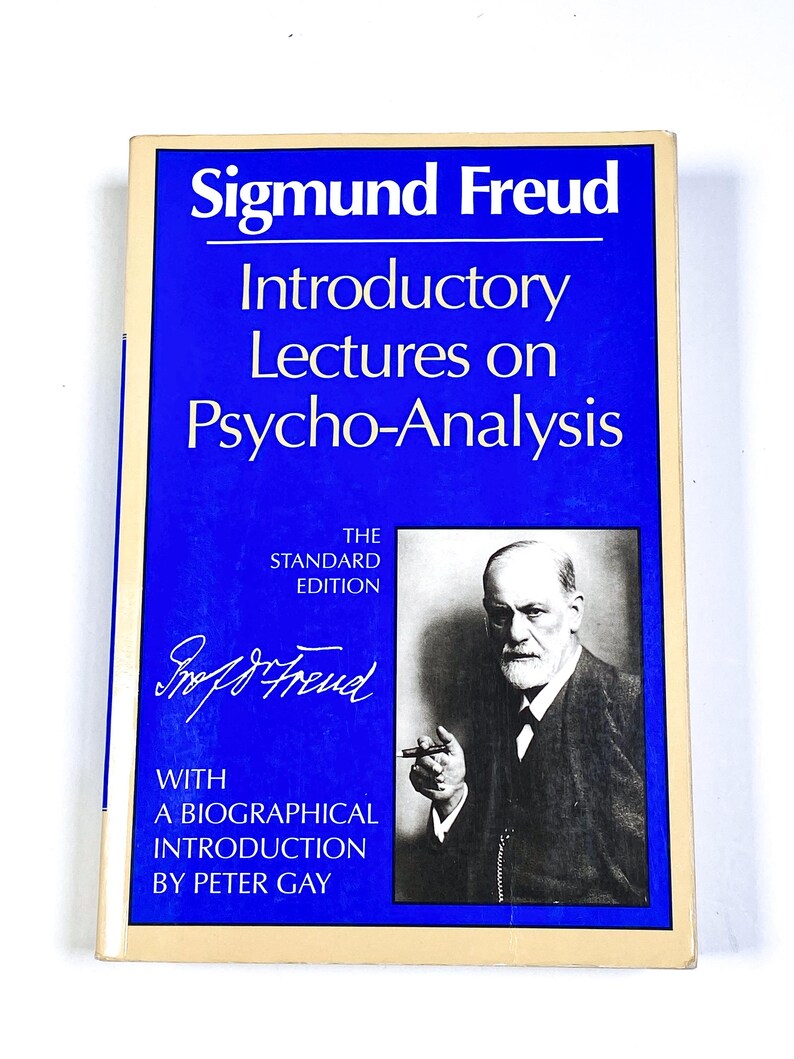 a blue book with a picture of a man holding a cigarette