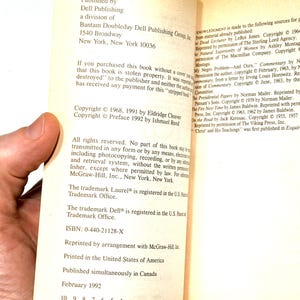 May include: Open book pages with text from Dell Publishing, including copyright information and ISBN. The book's pages are off-white with black text. The book is printed in the United States of America.