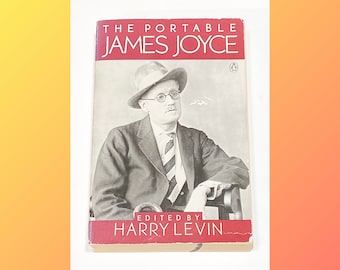 May include: A vintage book cover with a red background and white text. The title is "The Portable James Joyce" with the subtitle "Edited by Harry Levin". A black and white photo of James Joyce wearing a hat and glasses is featured on the cover.