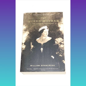 May include: A book cover with a black and white photo of Queen Elizabeth, The Queen Mother, wearing a crown and a black dress. The title of the book is "The Queen Mother: The Official Biography" by William Shawcross. The book cover also includes a quote from USA Today.