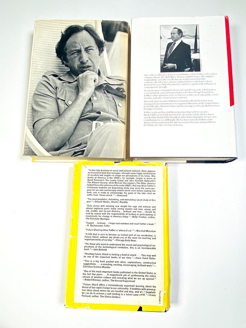 an open book with a picture of a man in a suit