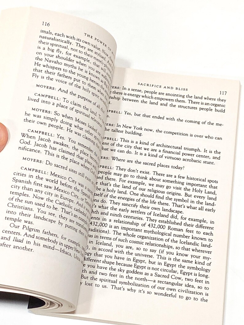 a person holding a book open to a page