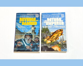 May include: Two paperback science fiction books with colorful covers. The book on the left is titled "Revenge of the Damned" and the book on the right is titled "The Return of the Emperor". Both books are part of the "Star Adventure" series and are written by Allan Cole and Chris Bunch.