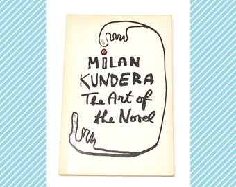 May include: A white book cover with black text that reads "Milan Kundera The Art of the Novel". The text is written in a hand-drawn style. There is a red dot and a black hand-drawn figure on the cover.