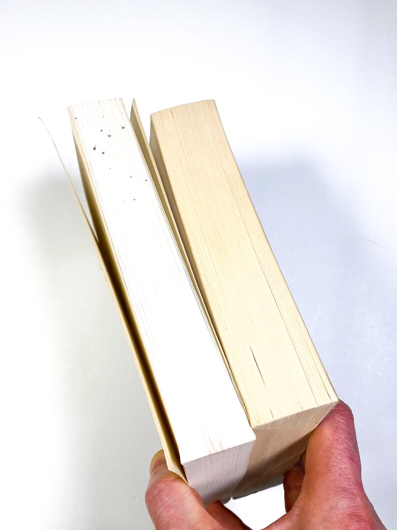 a person holding a piece of wood in their hand