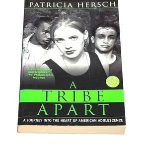 May include: A paperback book titled "A Tribe Apart" by Patricia Hersch. The cover features three young people in a black and white photo. The title is in large, green and black letters. The book is about American adolescence.