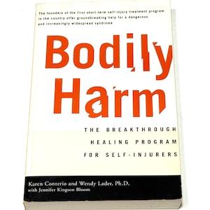 May include: A book titled "Bodily Harm" with large orange text on a white background. The book's subtitle reads "The Breakthrough Healing Program for Self-Injurers." The author's names are also visible.