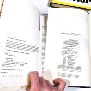 a person holding a book open to a page