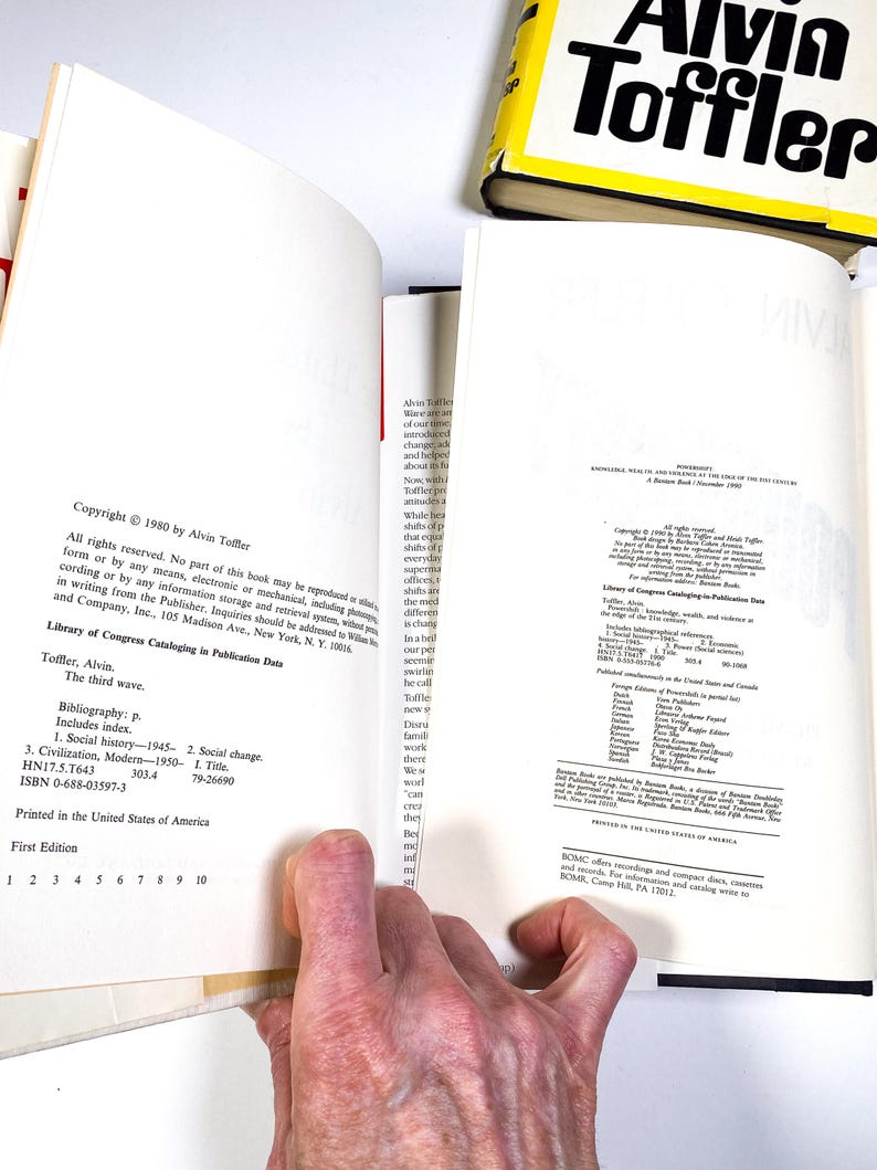 a person holding a book open to a page
