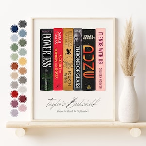 May include: A framed print featuring a collection of book spines with titles like "Powerless" and "It Ends With Us." The print is labeled "Taylor's Bookshelf" and "Favorite Reads In September."