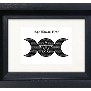 May include: A black framed print with a white background featuring a black and white triple moon symbol with a pentagram inside. The text "The Wiccan Rede" is printed above the symbol.