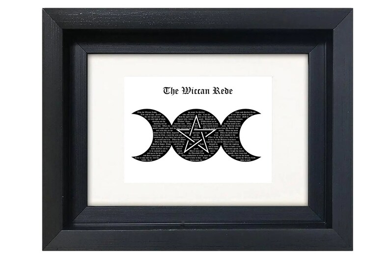 May include: A black framed print with a white background featuring a black and white triple moon symbol with a pentagram inside. The text "The Wiccan Rede" is printed above the symbol.