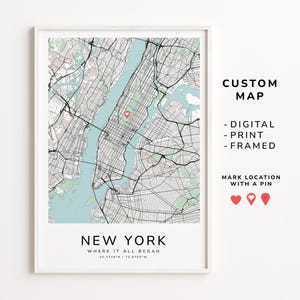 May include: A framed map print of New York City, featuring a detailed street layout with a light blue water color. The text "NEW YORK" and "WHERE IT ALL BEGAN" are displayed at the bottom. The image also includes the text "CUSTOM MAP - DIGITAL - PRINT - FRAMED".