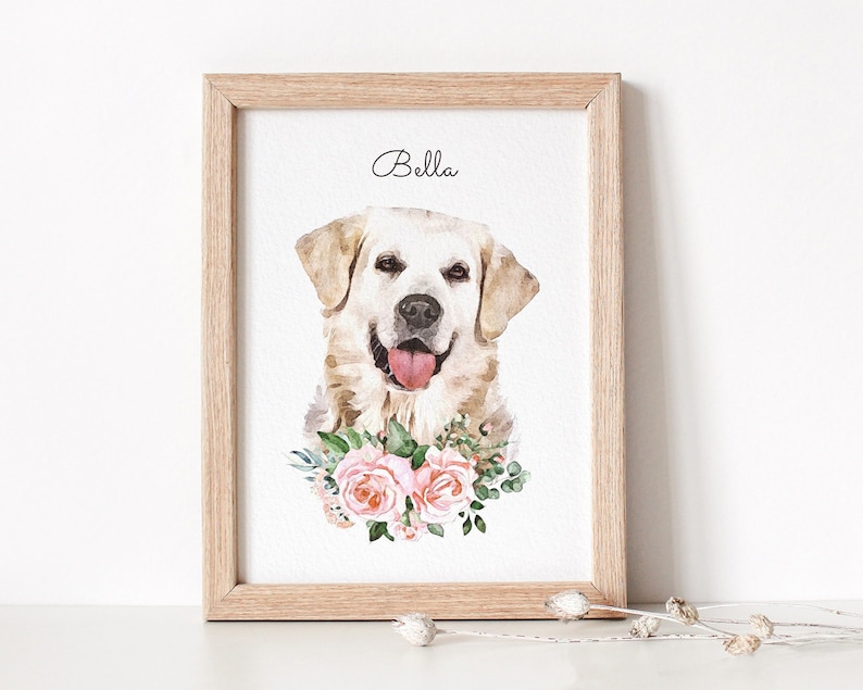 Watercolor dog portrait displayed in a wooden frame. The dog has a white coat. Below the dog portrait flowers are displayed.