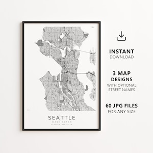 May include: A framed black and white map print of Seattle, Washington. The map shows the city's layout with streets and waterways. Text on the print reads "SEATTLE" and "INSTANT DOWNLOAD". Additional text indicates 3 map designs and 60 JPG files.