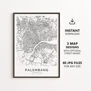 以下が含まれることがあります： インドネシアのパレンバンの白黒地図プリント。詳細な道路網と川が描かれています。テキストには「Palembang, Indonesia, 2.9861 S / 104.7566 E」と記載されています。画像にはダウンロードアイコン、3種類の地図デザイン、60個のJPGファイルが含まれています。