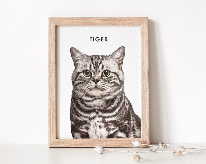 Watercolor cat portrait displayed in a wooden frame.