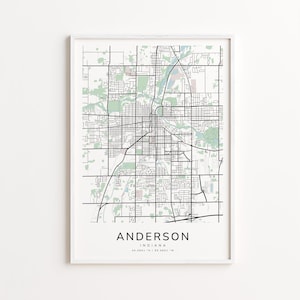 May include: A framed map print of Anderson, Indiana, with a grid of black lines representing streets and roads. The city name is printed in a clean, modern font at the bottom, along with the state and coordinates. The map is in black and white with green and tan areas.