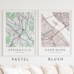 Mockup map print examples. Maps are displayed in a white frame on a white wall.
The example pictures are in portrait. The displayed maps are in pastel and blush color palettes.